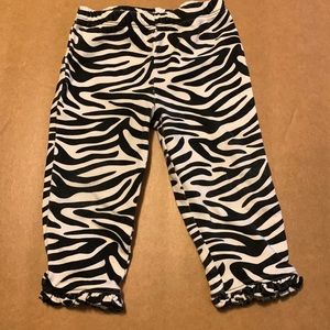 Zebra print pants with ruffle bottom